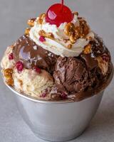 Delicious ice cream sundae with chocolate sauce and pretzels. photo