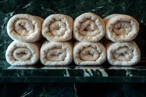 Spa Elegance and Luxury with Rolled White Towels on Marble Surface photo