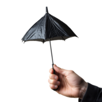 Person holds a folded black umbrella against a plain transparent background during cloudy weather, Folded umbrella in hand and single isolated on transparent png