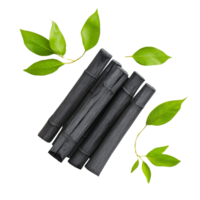 Charcoal Sticks and Green Leaves Arranged Aesthetically png