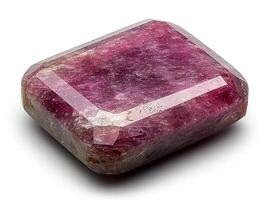 polished ruby gemstone vibrant deep red hue sits on pristine white surface. Soft lighting enhances its clarity and flawless facets revealing its brilliance photo
