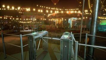 Empty amusement park with carousel and bright lights at night video