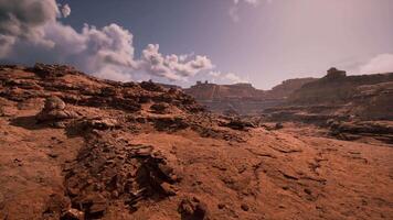 Expansive desert landscape showcasing rocky formations under a bright sky video