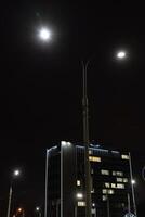 Illumination of a tall building in Minsk. University building at night photo