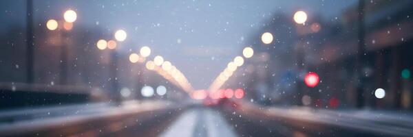 Blurred winter street with falling snow and faint lens flare photo