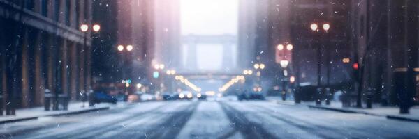 Blurred winter street with snow, tall buildings, and glowing lights photo
