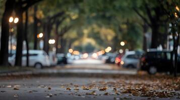 Quiet street with trees, parked cars, and warm light leaks in the background photo