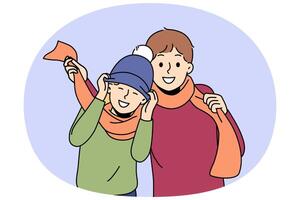Little boys in winter hats and scarves rejoicing at onset of winter and preparing for walk in park vector