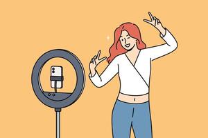 Woman blogger dances in front of phone on tripod with ring lamp, ready-made for social media vector