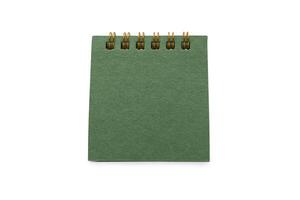 Blank green desk calendar with Clipping path isolated on white background. Calendar concept with copy space for text or infographic. photo