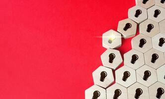 Luminous bulb idea breaks out. Breakthrough ideas. Innovation, fresh look. Revolutionary technology. Breaking new ground. Business unicorn. New paradigm. Successful uncommon solution to a problem. photo