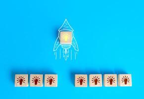 Block with the idea light bulb took off on an imaginary rocket doodle. Developing startup. Choosing best idea. Success investment. Business accelerator. Optimal solution. Creativity photo