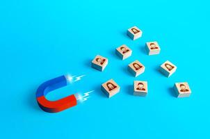 Magnet attracts people. Recruiting new workers. Poaching employees to more favorable conditions. Search for specialists and professionals. Business team building. Hiring. Collection of personal data photo
