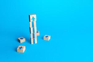 Block tower with arrows. Business growth and development concept. Achieve success. Building career advancement, improving skills. Goal achievement. Progress and movement forward. Self improvement photo