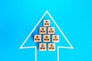 A group of people in the arrow. Movement in a single formation. Joint achievement of goals and tasks. Unity. Society consolidation. Team discipline, teamwork cooperation. Coordination of actions. photo