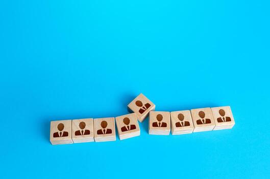 Person trying to enter a row of people. Exceeding the maximum optimal number of team members, reducing efficiency. Unsuitable employee. Inflating staff. Violation of integrity and coherence of team. photo