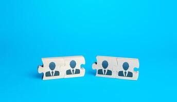 Two groups of puzzles with people on a blue background. Create effective team for a new project. Restructuring, business optimization, HR staff management recruiting. Combining efforts. Cooperation. photo