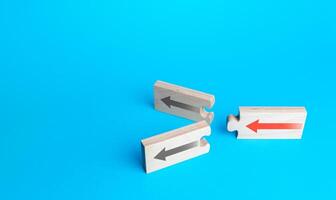 Arrow puzzles with alternative paths on a blue background. Choosing a further path, alternative options. Choice, new possibilities. Progress. Best estimate. Choose from two variations. Fork concept photo