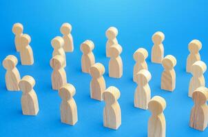 A large number of figures of people on a blue background. Crowd, Maintaining a safe distance in queue. New normal. Society concept. Communication. Population and citizens. Large group. Community photo