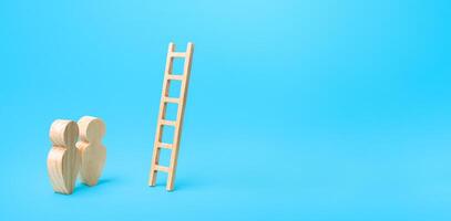 People stand near a ladder to nowhere. Career ladder. Open possibilities concept. Opportunity for growth and development. A deceiving way. Not the best option. Fears of going forward. Instability photo