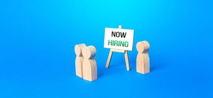 People and easel with a call Now hiring. Recruitment new employee workers. Search for specialists and professionals. Staff job interview. Headhunter hr. Selection of candidates for open vacancies photo