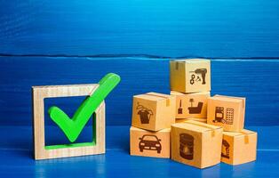 Boxes and green check mark. Free Trade Area and Economic Preferences Agreement. Verification of imported goods products. Quality control. Trade agreements. Available in stock. Import and Sale Permits. photo