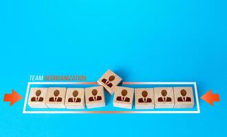 Blocks with employees are squeezed out of the shrinking progress bar. Reducing the composition of the team to fewer members. Reorganization, new company policy. Rise efficiency and productivity. photo