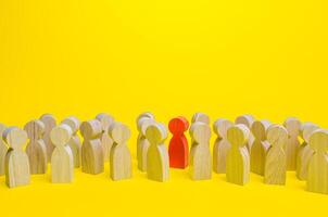 Red man in a crowd. Stranger, eye-catching. Different, special. Infected carrying threat of pandemic spread. Collective immunity. Social distance. Intruder detection. Coming out. Be different photo