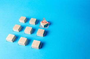 One of the blocks breaks the formation. Violation of order, malfunction failure. Deviation from the norm. Determination and correction of the error. Disorder process. Discipline staggered photo