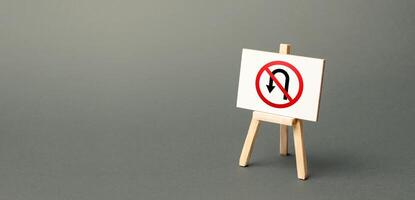 Easel with no turning back traffic sign. Assertiveness and striving, moving forward without retreating. Go to the goal, don't stop. Finish things. No step back photo