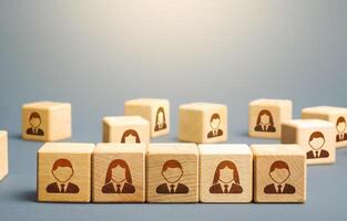 Line of blocks with employees. Building a business team from many candidates. Personnel management, team group formation for a new project. Hiring and recruiting workers. Cooperation and collaboration photo