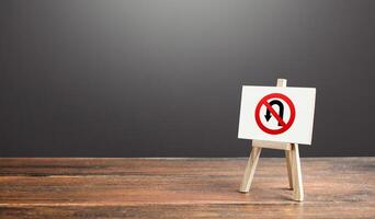 Easel with no turning back traffic sign. Go to the goal, don't stop. Assertiveness and striving, moving forward without retreating. Finish things. There is no way back. Obstinacy and irrevocability photo