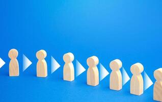 Figures of people stand in a row and consistently convey information to each other. Chain reaction, spread of information and rumors exchange. Partnership, unity, assistance. Interaction of persons. photo