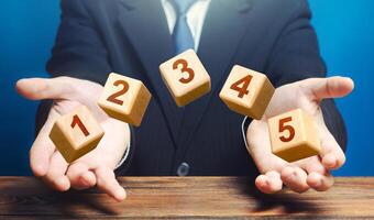 Man throws 5 numbered blocks with the numbers one two three four five from his hands. Five easy steps. Organization and systematization, step by instructions. Business planning, action plan. photo