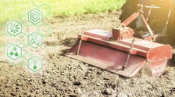 Tractor with milling machine loosens, grinds and mixes ground and hexagons with innovations. Science of agronomy. Improvement in quality and yield growth. Reducing the impact on the environment. photo