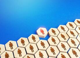 A person comes out of a group of people. Exit from mainstream society. Dismissal. Be different. Cooperation collaboration, joint efforts. Initiative. Expulsion from community. Talent, leadership. photo