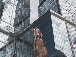 Russia, Moscow, September,30 2020. Abstract background with blurred reflections in mirrors. Abstract fragment of modern architecture, walls made of glass photo