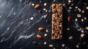 Artfully styled granola bar with chocolate chips, oats, and nuts photographed on black marble background with soft natural lighting and macro detail focus. food photo
