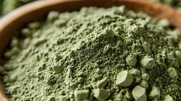 Premium matcha powder showcases vibrant green color and fine texture in aerial view, highlighting traditional Japanese tea qualities through detailed particle visualization. texture photo