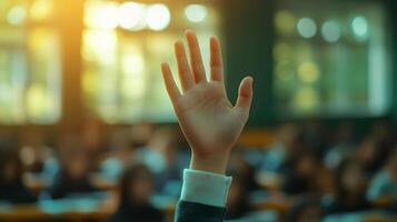 White-sleeved hand raises in classroom environment, representing participation and volunteering against blurred background with warm lighting and educational context. responsive photo