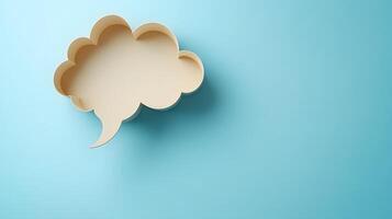 Light blue background features speech bubble cutout in paper craft style, presenting communication concept with beige balloon shape and soft shadow effects. expression photo