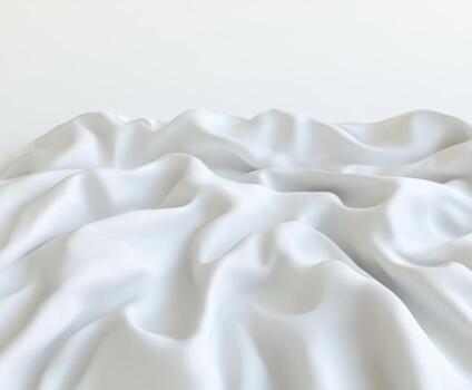 Soft white fabric gently draping over a textured surface in a minimalist setting with warm natural light photo