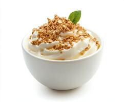 Creamy yogurt topped with crunchy granola and a fresh mint leaf creates a delightful snack photo