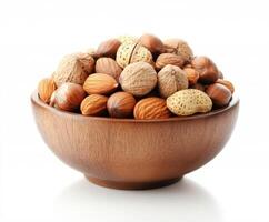 Various nuts arranged in a wooden bowl showcasing their natural textures and hues for healthy snacking photo