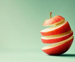 Sliced red apple showcasing layers against a soft green background in a minimalist setting photo