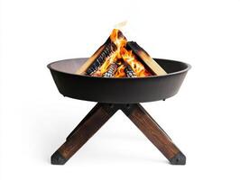 Fire burns brightly in a modern outdoor fire pit, providing warmth and ambiance for evening gatherings in a backyard setting photo