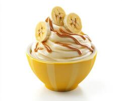Creamy banana dessert topped with caramel sauce and fresh banana slices served in a bright yellow bowl photo