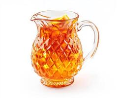 Clear glass pitcher filled with refreshing iced tea ready for a summer picnic or gathering photo