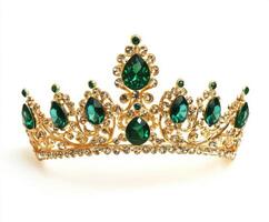 Elegant golden tiara adorned with emerald and diamond-like gemstones for special occasions photo