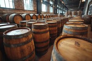 Wine or whiskey barrels resting in cellar warehouse photo